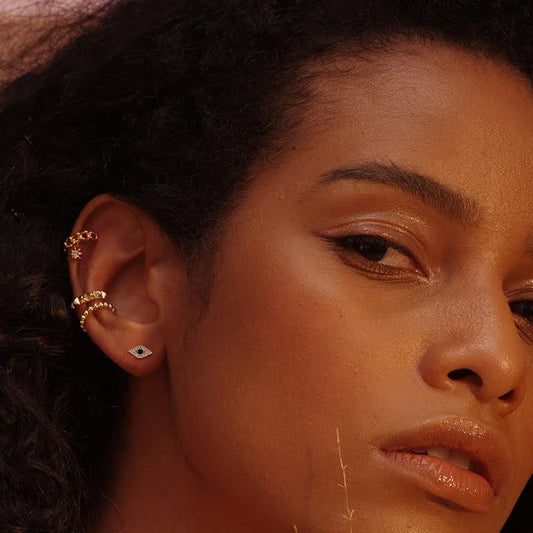 Luxurious gold and dark blue eye earrings with premium 14K gold-plated copper construction for sophisticated style