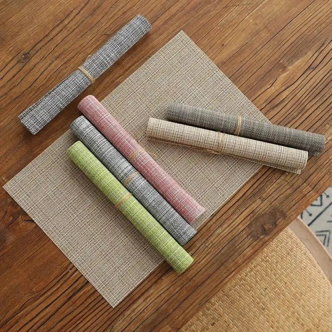 Stylish and durable waterproof placemats in black, protecting a dining table from spills and stains