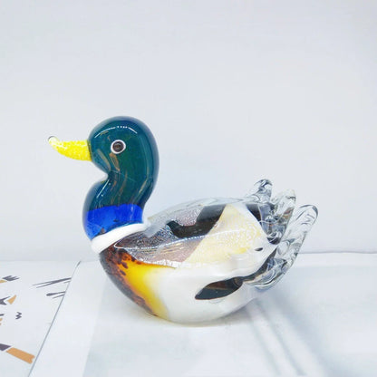 Handcrafted glass ornament in the shape of a Mandarin duck with vibrant colours and intricate details