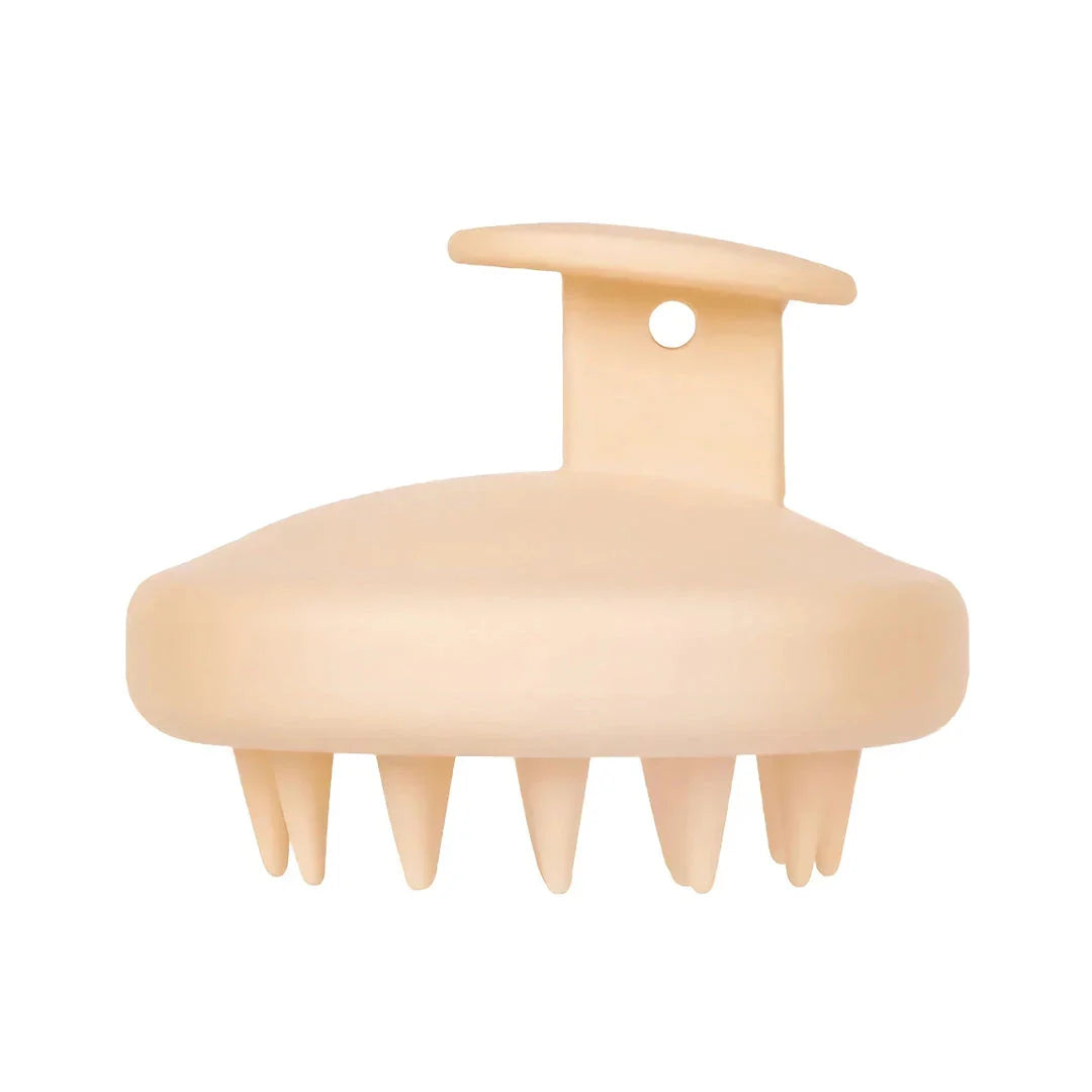 A green silicone scalp massager with soft bristles, designed to provide a soothing hair washing experience and promote healthy hair growth.