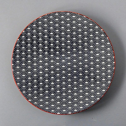 Elegant ceramic plates with vibrant, whimsical prints in a variety of enchanting designs
