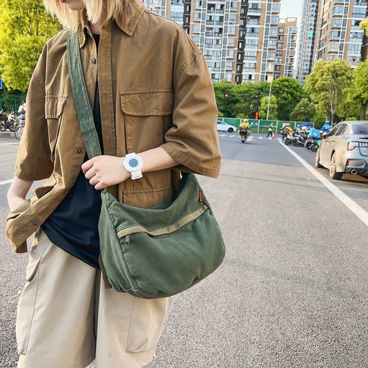 A stylish and durable canvas tote bag with a spacious interior and a timeless vintage-inspired design, perfect for everyday use and travel