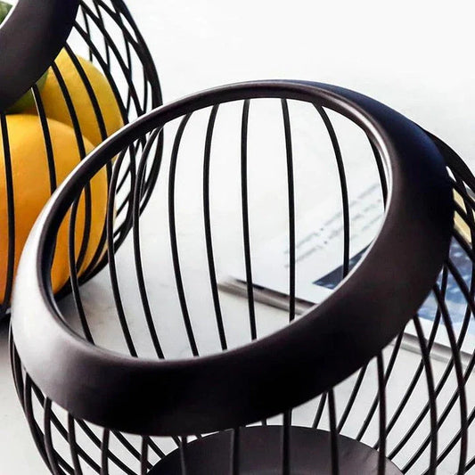 Black Nordic-style metal drain basket with perforated design for efficient drainage