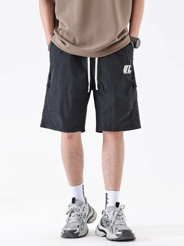 Premium Mountaineering Trousers in black and khaki colours, featuring a relaxed straight-leg fit and durable nylon construction for outdoor adventures.