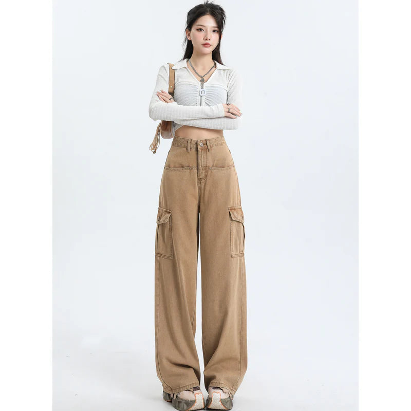 A pair of pink high-waist baggy jeans with a straight-leg design, featuring vintage-inspired details like buttons and faux zippers.