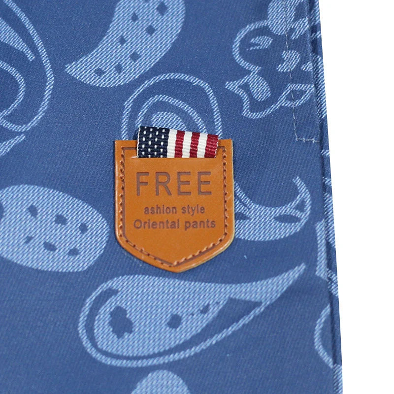 Relaxed-fit sports shorts in light blue and denim blue mosaic patterns, designed for casual everyday wear