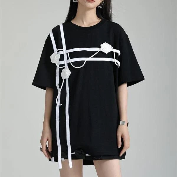 A stylish black and white floral half-sleeve casual t-shirt with a classic round neckline, perfect for everyday wear.