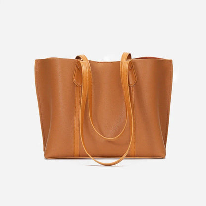 Premium cowhide leather shoulder bag with multiple compartments and adjustable strap for versatile everyday use