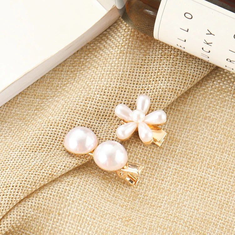 Elegant silver-toned hair clip with a beautiful pearl flower design, a timeless British-inspired accessory