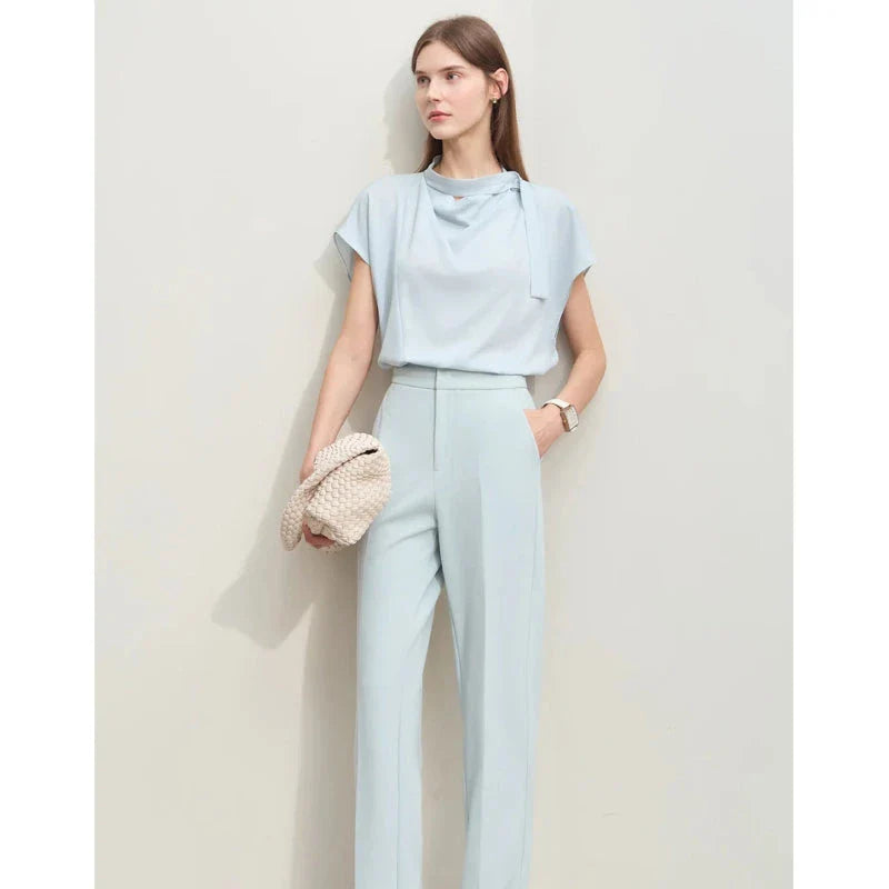 Elegant minimalist women's summer blouse in blue chiffon fabric with tie sleeves and hollow-out decoration