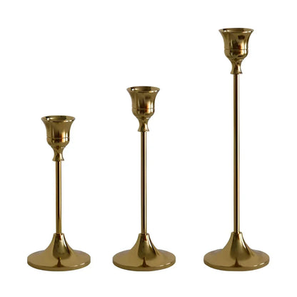 Elegant brass gold candlestick holder set with varying heights, perfect for enhancing the ambiance of any room in the home.