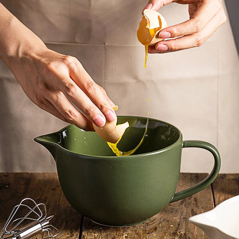 Premium porcelain mixing bowl with ergonomic handle and pointed drainage design for easy baking at home