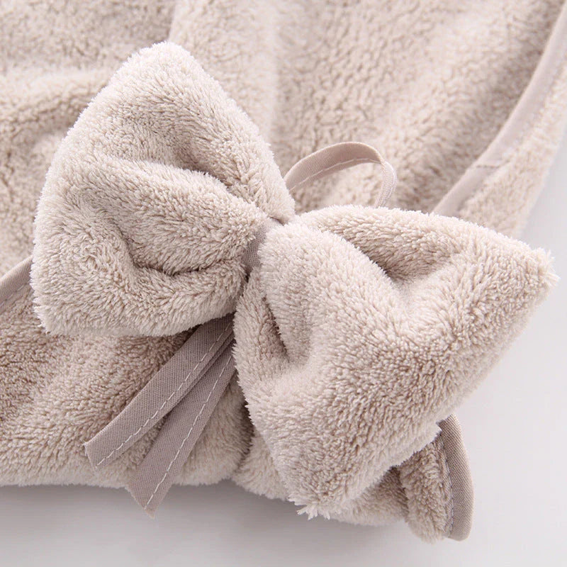 Elegant coral fleece hand towels with a unique bow design, perfect for kitchen and bathroom use