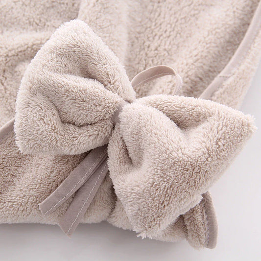 Elegant coral fleece hand towels with a unique bow design, perfect for kitchen and bathroom use