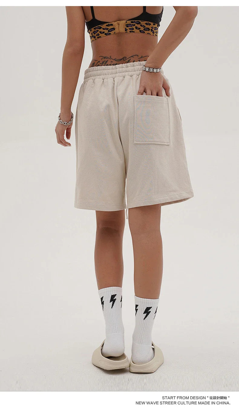 Premium loose-fit sports shorts with eye-catching printed patterns in black, khaki, and dark grey colours