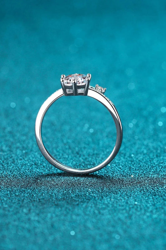 Elegant Moissanite and Sterling Silver Ring with a sparkling centre stone, delicate zircon accents, and a luxurious 925 sterling silver setting
