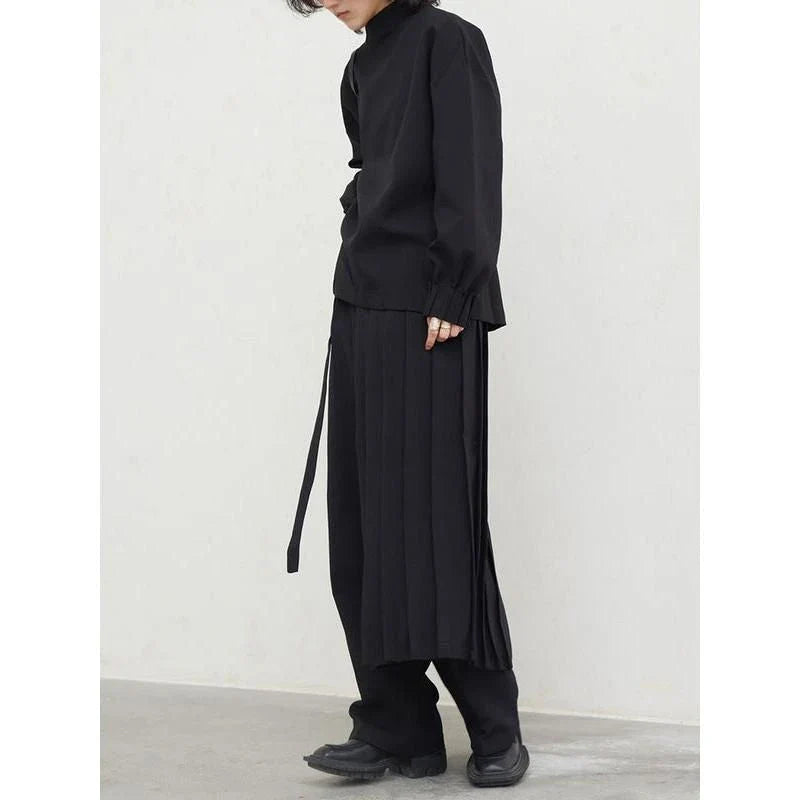 Fashionable pleated sweatshirt and wide-leg trousers set in grey, featuring a relaxed, comfortable silhouette and modern design.