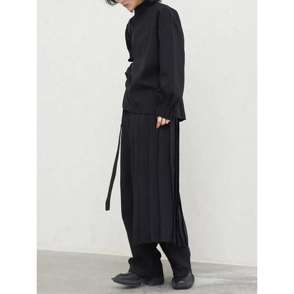 Fashionable pleated sweatshirt and wide-leg trousers set in grey, featuring a relaxed, comfortable silhouette and modern design.