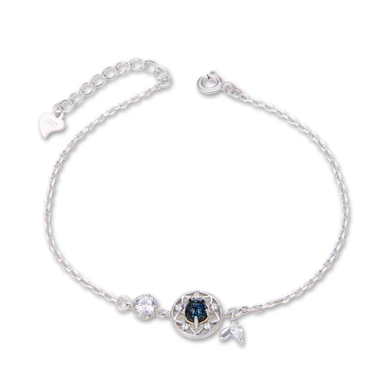 Enchanting sterling silver bracelet with genuine moonstone and celestial motifs