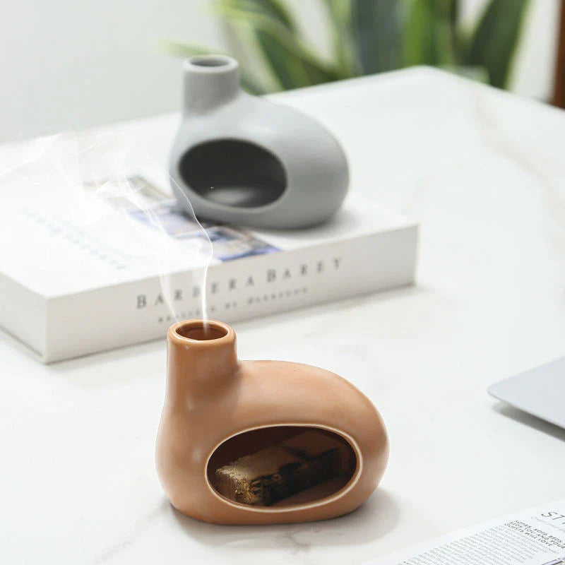 Elegant ceramic tabletop incense burner with Palo Santo wood aroma, available in light brown, white, and grey colours