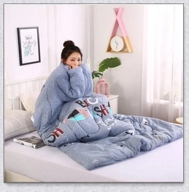 A cosy, wearable quilt with sleeves in a variety of colourful designs, perfect for staying warm and comfortable during the winter months.