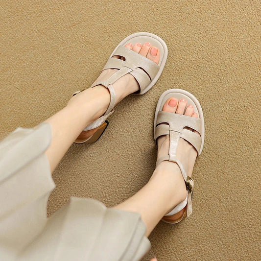 Genuine leather gladiator sandals with chunky heel, open-toe design, and secure buckle closure for summer style and comfort.