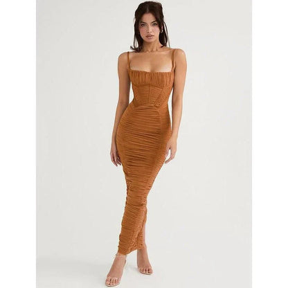 Elegant spaghetti strap backless maxi dress in black with ruched detailing and ankle-length cut