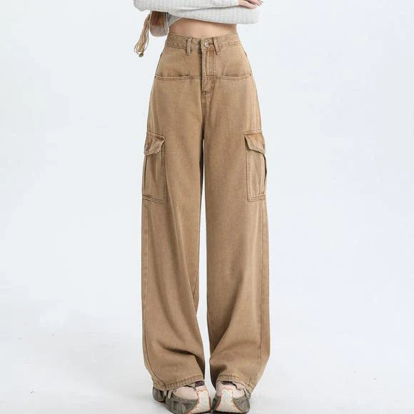 A pair of pink high-waist baggy jeans with a straight-leg design, featuring vintage-inspired details like buttons and faux zippers.