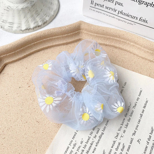 Handmade floral elastic hair bands with soft chiffon fabric and vibrant embroidered daisy patterns, perfect for enhancing everyday style in the UK.