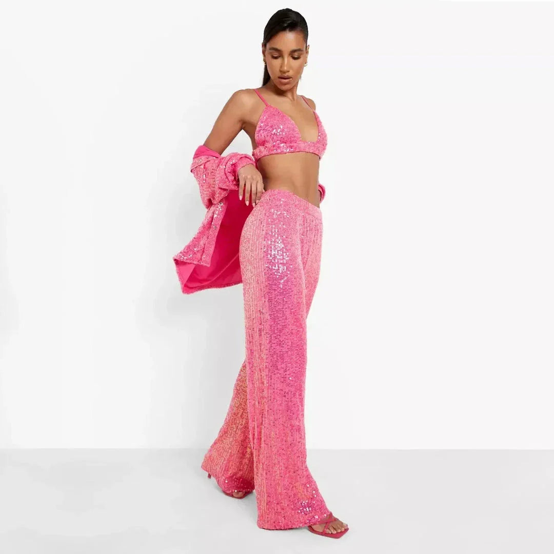 Elegant woman wearing a luxurious sequin top and pants set, perfect for a glamorous evening event