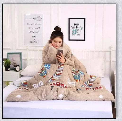 A cosy, wearable quilt with sleeves in a variety of colourful designs, perfect for staying warm and comfortable during the winter months.