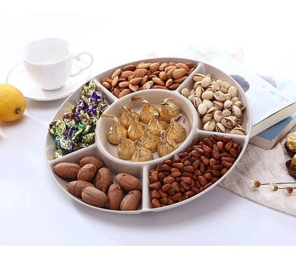 Stylish round snack plate in green and khaki colours, perfect for serving fruit, nuts, or hors d'oeuvres at UK dinner parties and tea times.