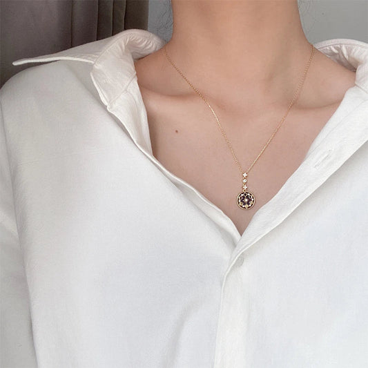 Elegant silver necklace with diamond detailing, geometric pattern, and adjustable length