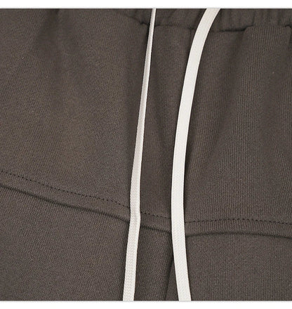 Premium loose-fit sports shorts with eye-catching printed patterns in black, khaki, and dark grey colours