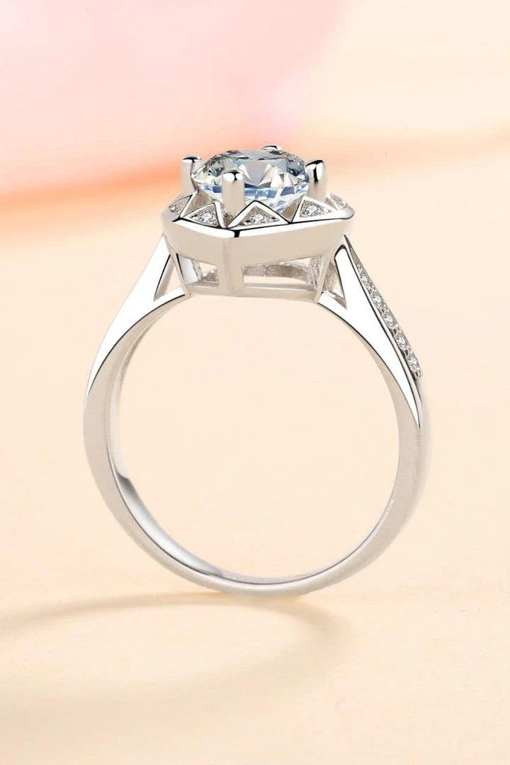 Elegant moissanite heart-shaped ring in sterling silver setting with zircon accent stones