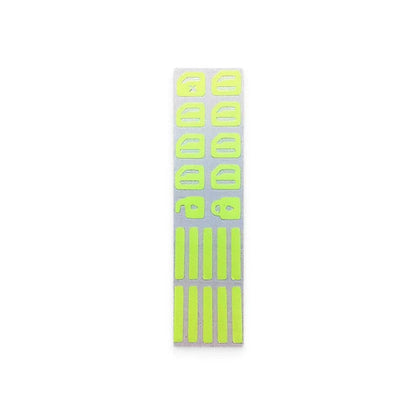 Fluorescent car button stickers emitting a bright green glow for easy visibility in the dark