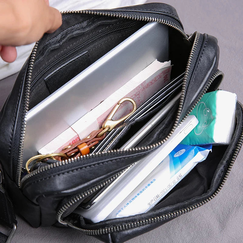 Premium black leather shoulder bag with adjustable strap and multiple compartments for organised storage