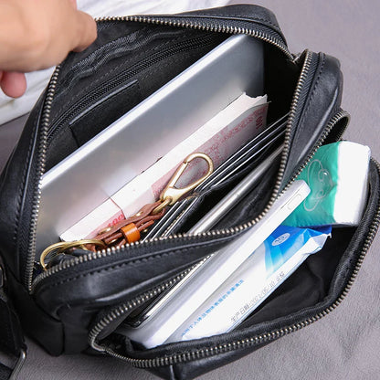Premium black leather shoulder bag with adjustable strap and multiple compartments for organised storage