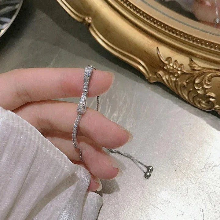 Elegant 925 sterling silver bow bracelet with minimalist design for stylish women