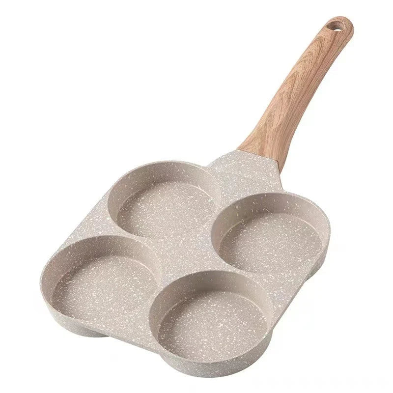 Premium non-stick frying pan with four-hole design for cooking eggs, burgers, and more - a versatile kitchen essential from a British brand