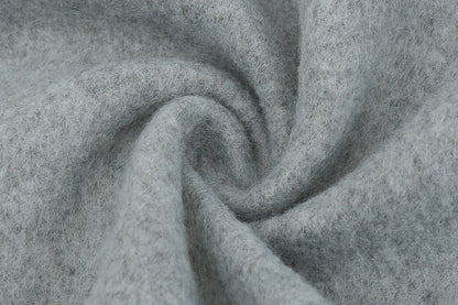Premium British woollen coat with stand collar, featuring a sleek, slim-fit silhouette and subtle stitching details