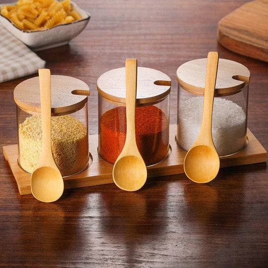 Elegant glass canister with wooden spoon, a versatile kitchen accessory for storing and displaying pantry items