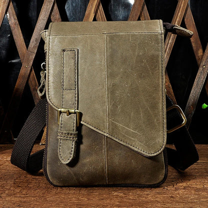 Premium cowhide leather one-shoulder crossbody bag in light grey colour with adjustable strap and zipper pocket