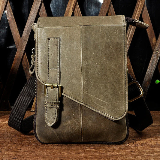 Premium cowhide leather one-shoulder crossbody bag in light grey colour with adjustable strap and zipper pocket