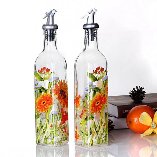 Ethnic-inspired glass bottles with handpainted floral designs, offering stylish storage for sauces, oils, and spices