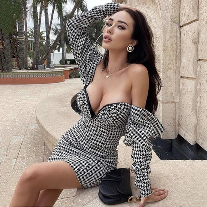 Sophisticated houndstooth wrap dress with flattering high waist and premium polyester construction