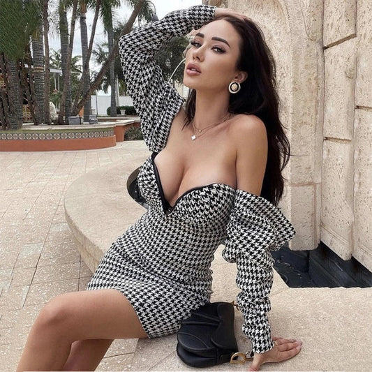 Sophisticated houndstooth wrap dress with flattering high waist and premium polyester construction