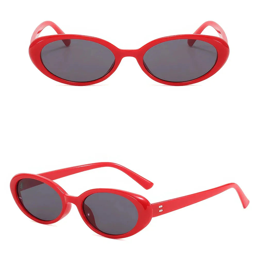 Oval-shaped women's sunglasses in a white and grey colour, offering UV protection and a stylish, retro-inspired design.