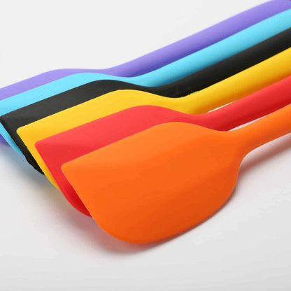 Versatile non-stick silicone cooking spatula in various colours, perfect for flipping, stirring, and serving a wide range of dishes