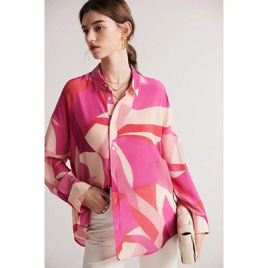 Elegant silk crepe de chine blouse in a unique print design, featuring a loose, straight fit and classic collar for a sophisticated yet comfortable look.